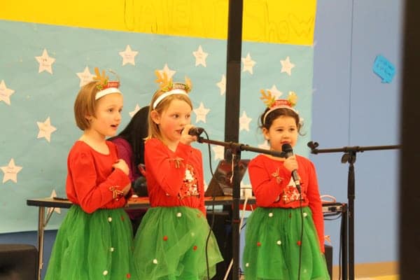 Singing Girl Trio in Matching Holiday Attire