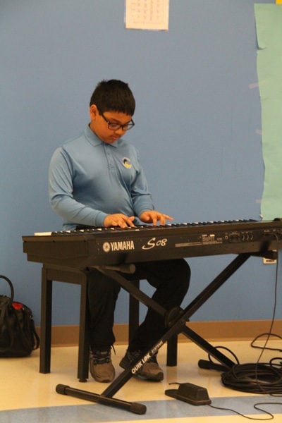 Boy Playing Keyboard at Talent Show